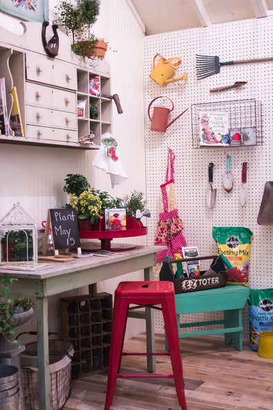 Well organised garden shed with work bench and stool